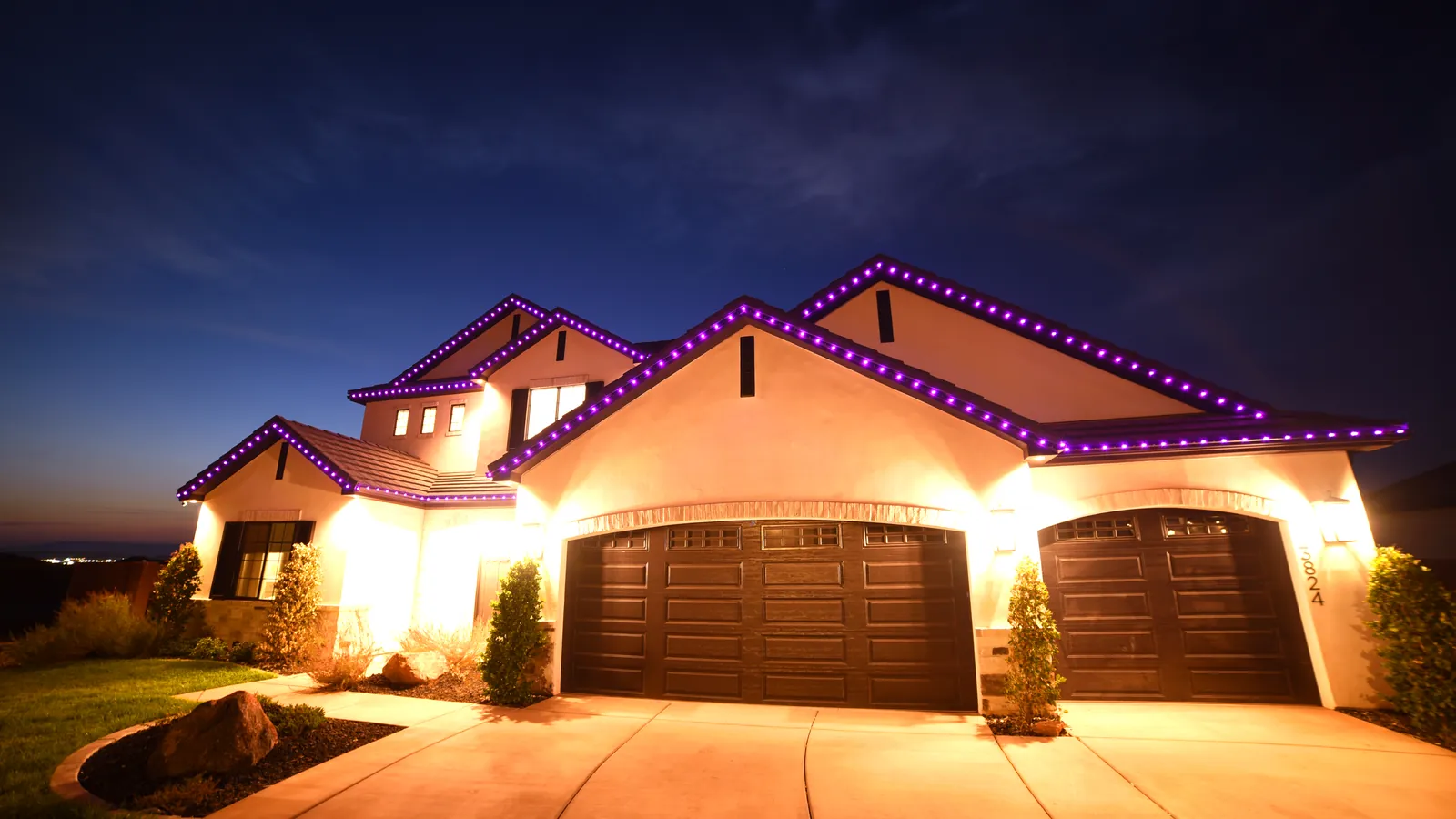 Roofline lighting set to a purple color scene at night